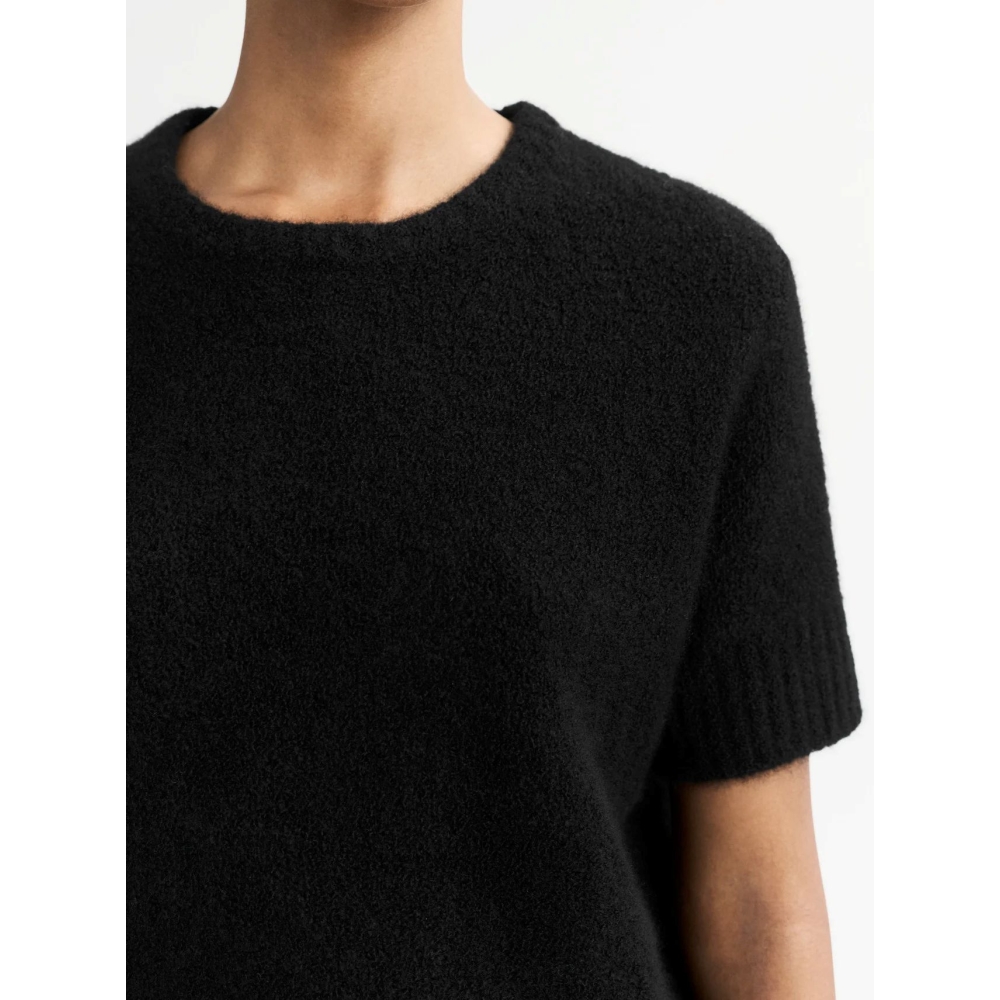 Soft Goat "Boucle" black sweater. Skirts