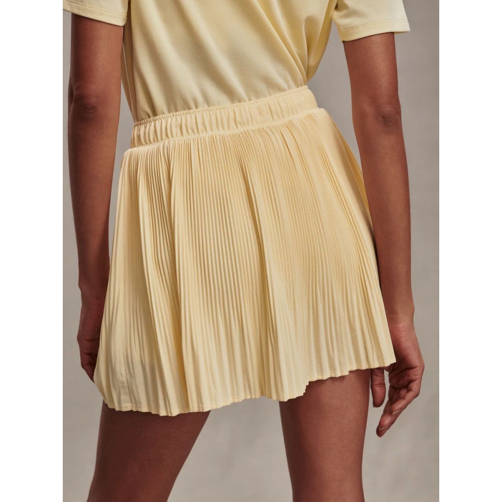 Varley Sijonai "Davina High-Rise Skort" gelsvos spalvos sijonšorčiai Varley "Davina High-Rise Skort" gelsvos spalvos sijonšorčiai. Sijonai