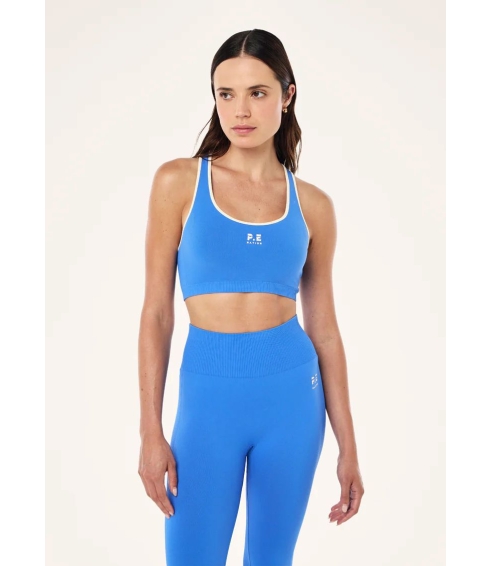 "Restore Seamless Sports Bra" besiulė mėlynos spalvos sportinė liemenėlė. Sportinės liemenėlės