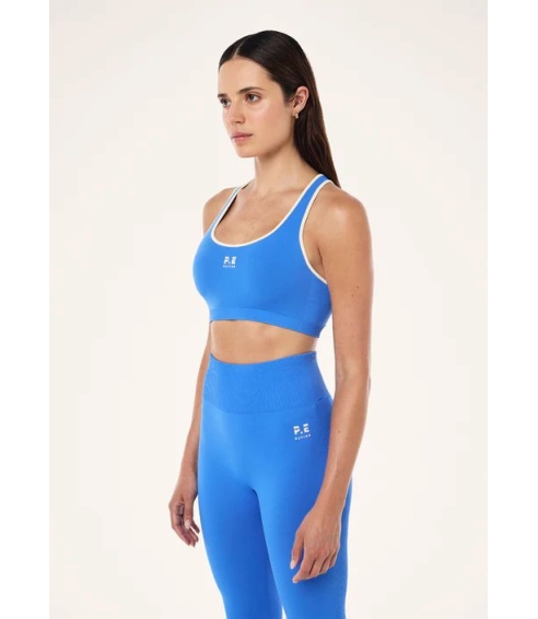 "Restore Seamless Sports Bra" besiulė mėlynos spalvos sportinė liemenėlė. Sportinės liemenėlės